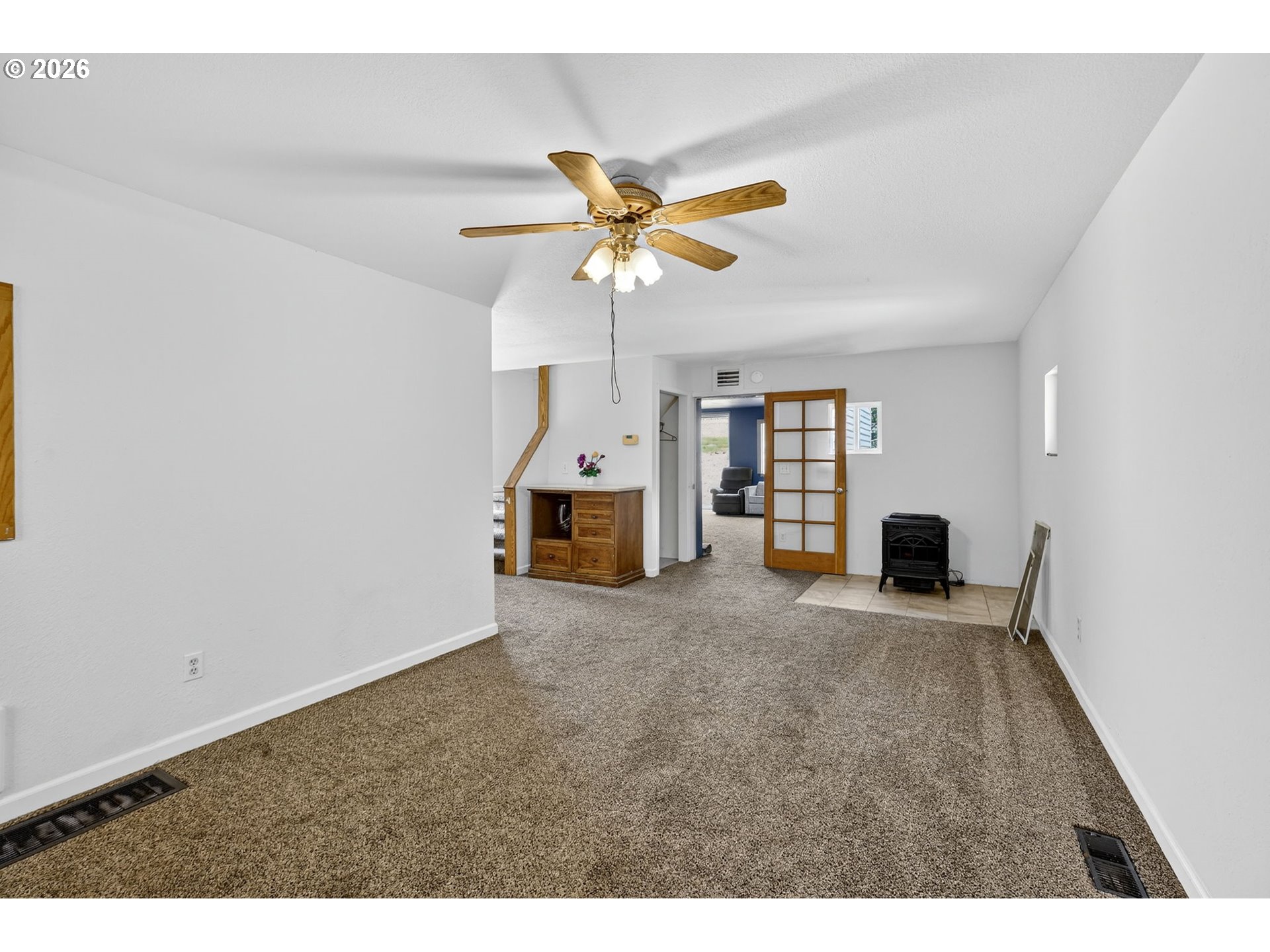 72 Brunning Road Stevenson, WA 98648 - Photo 12 of 47 a view of a livingroom with wooden floor and a ceiling fan