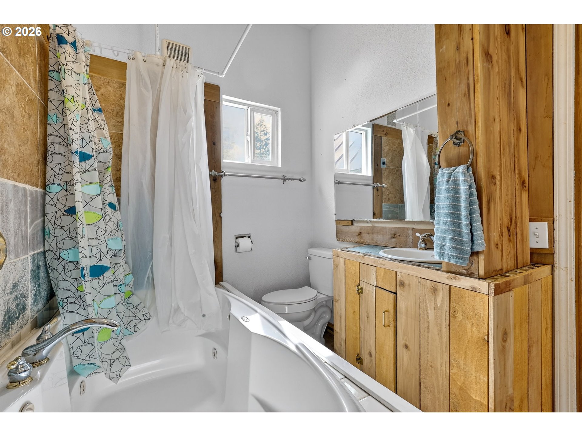 72 Brunning Road Stevenson, WA 98648 - Photo 26 of 47 a bathroom with a granite countertop sink a mirror and shower