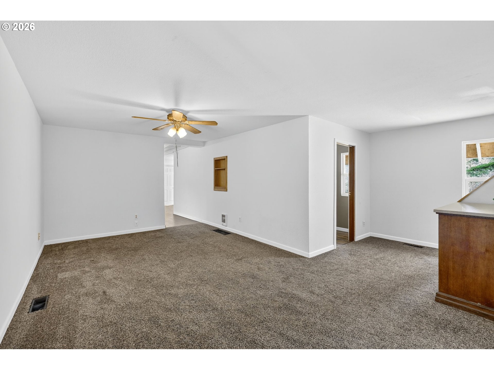 72 Brunning Road Stevenson, WA 98648 - Photo 10 of 47 a view of a livingroom with a ceiling fan and entryway