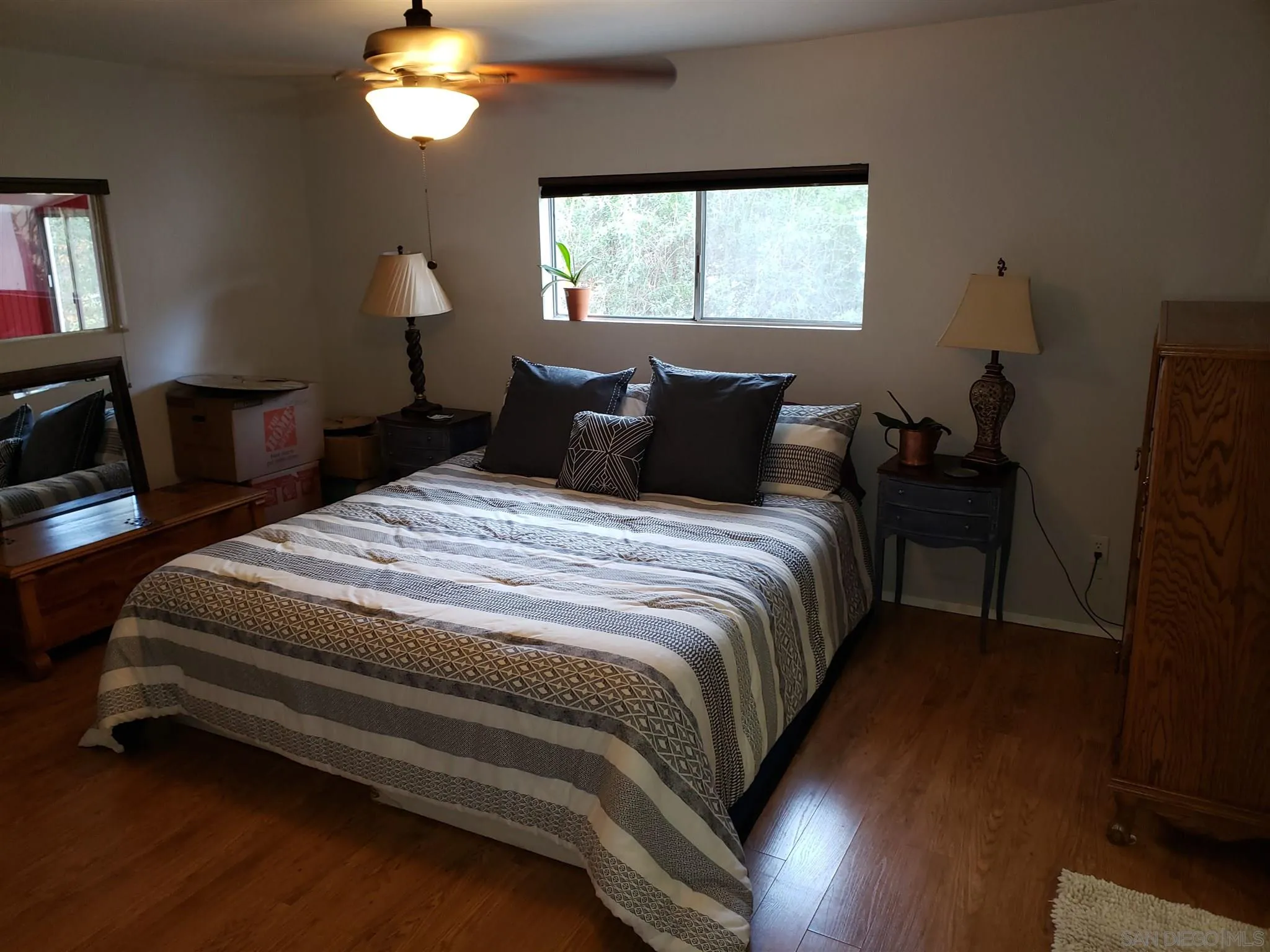 3909 Reche Road, Unit 151 Fallbrook, CA 92028 - Photo 14 of 24 a bedroom with bed and window