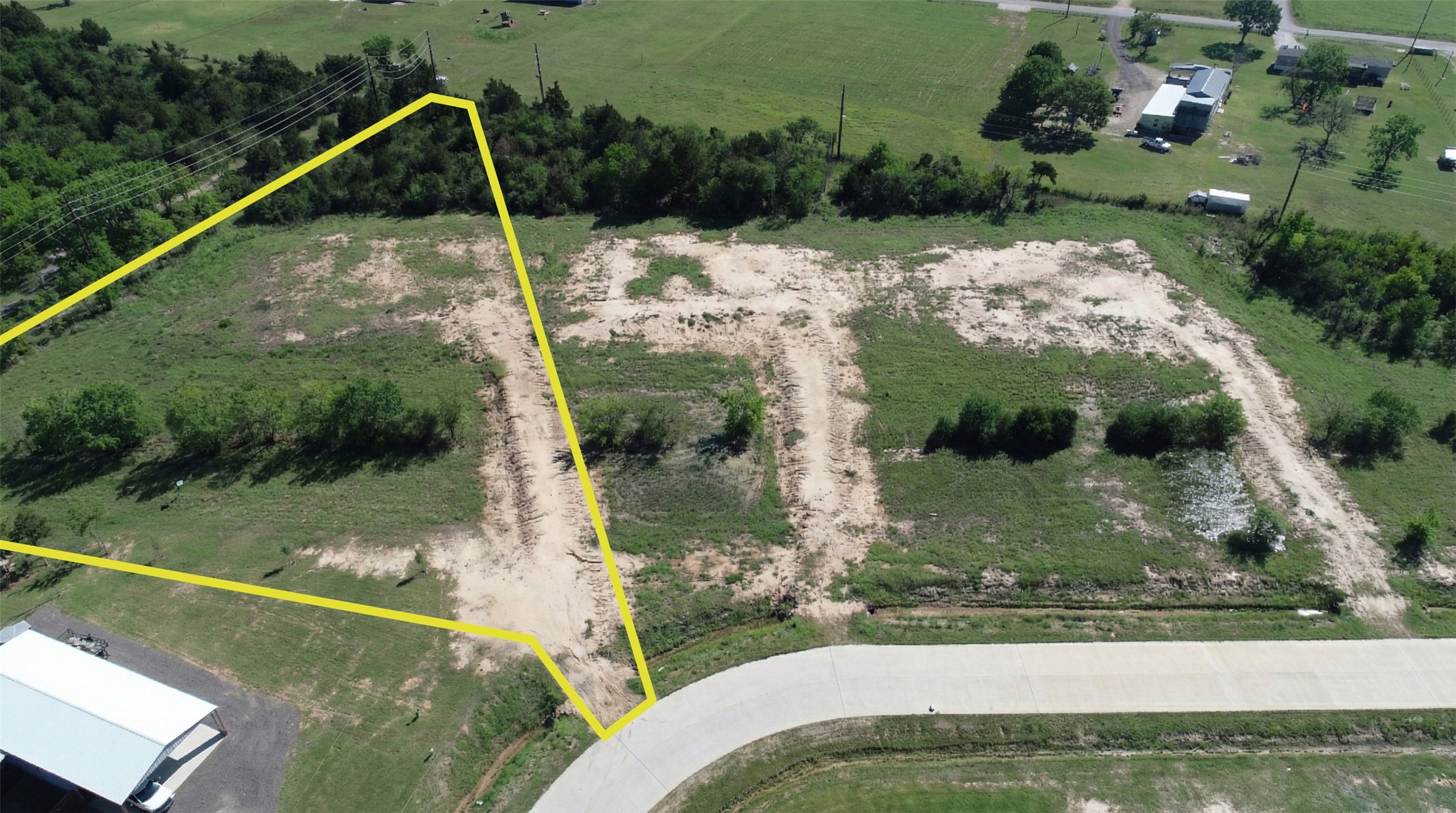 1423 Southfork Ranch Drive Sealy, TX 77474 - Photo 2 of 15 Aerial view showcasing the surrounding area and nearby development, highlighting the property’s build-ready path, savings thousands of dollars