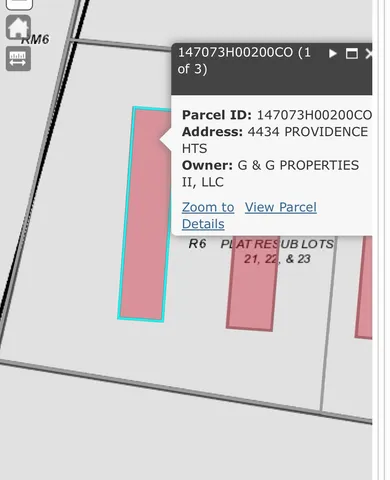 a aerial view of a house with a yard