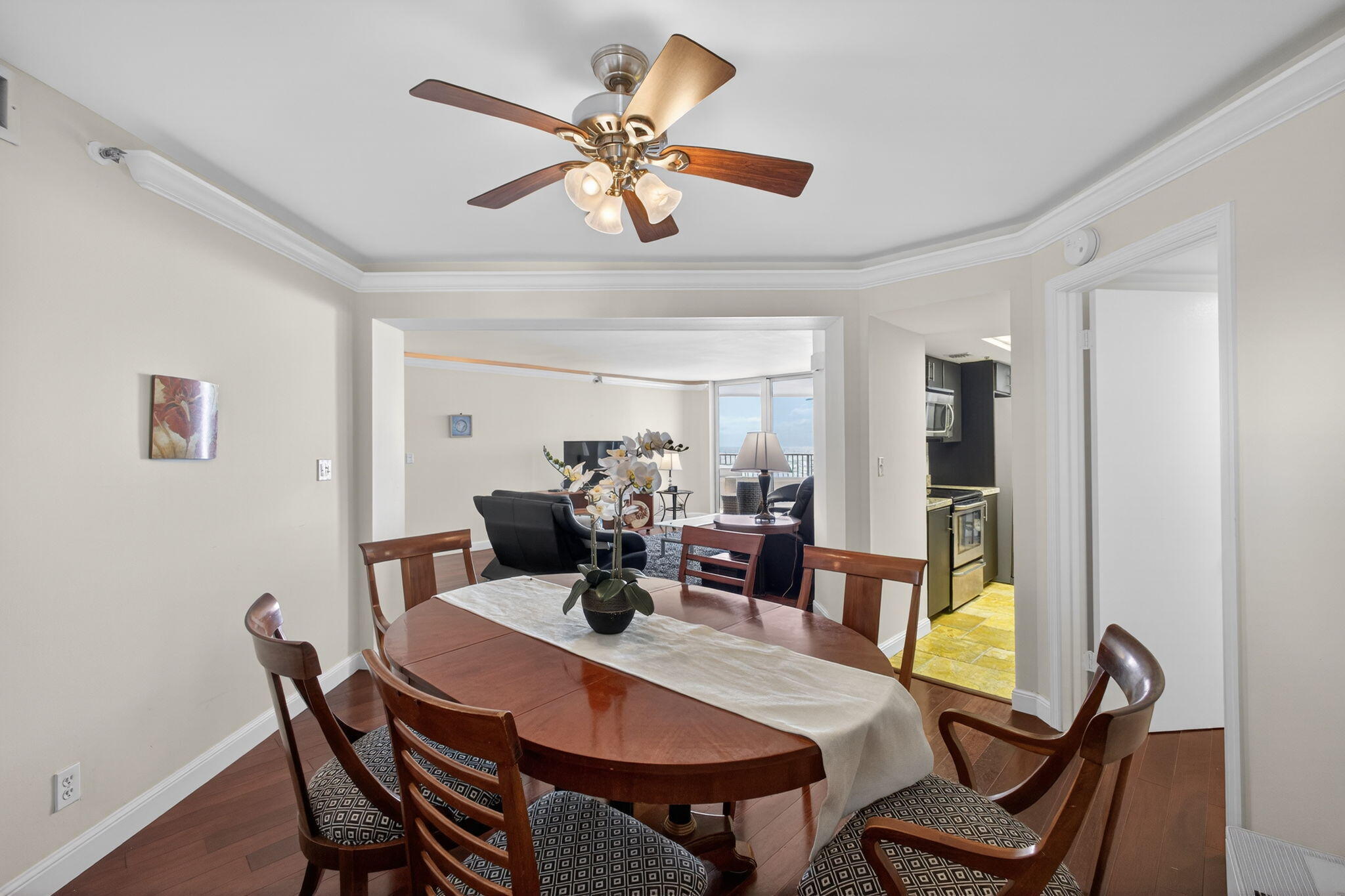 5200 North Ocean Drive, Unit 1004 Singer Island, FL 33404 - Photo 14 of 26 a view of a dining room with furniture and a chandelier fan