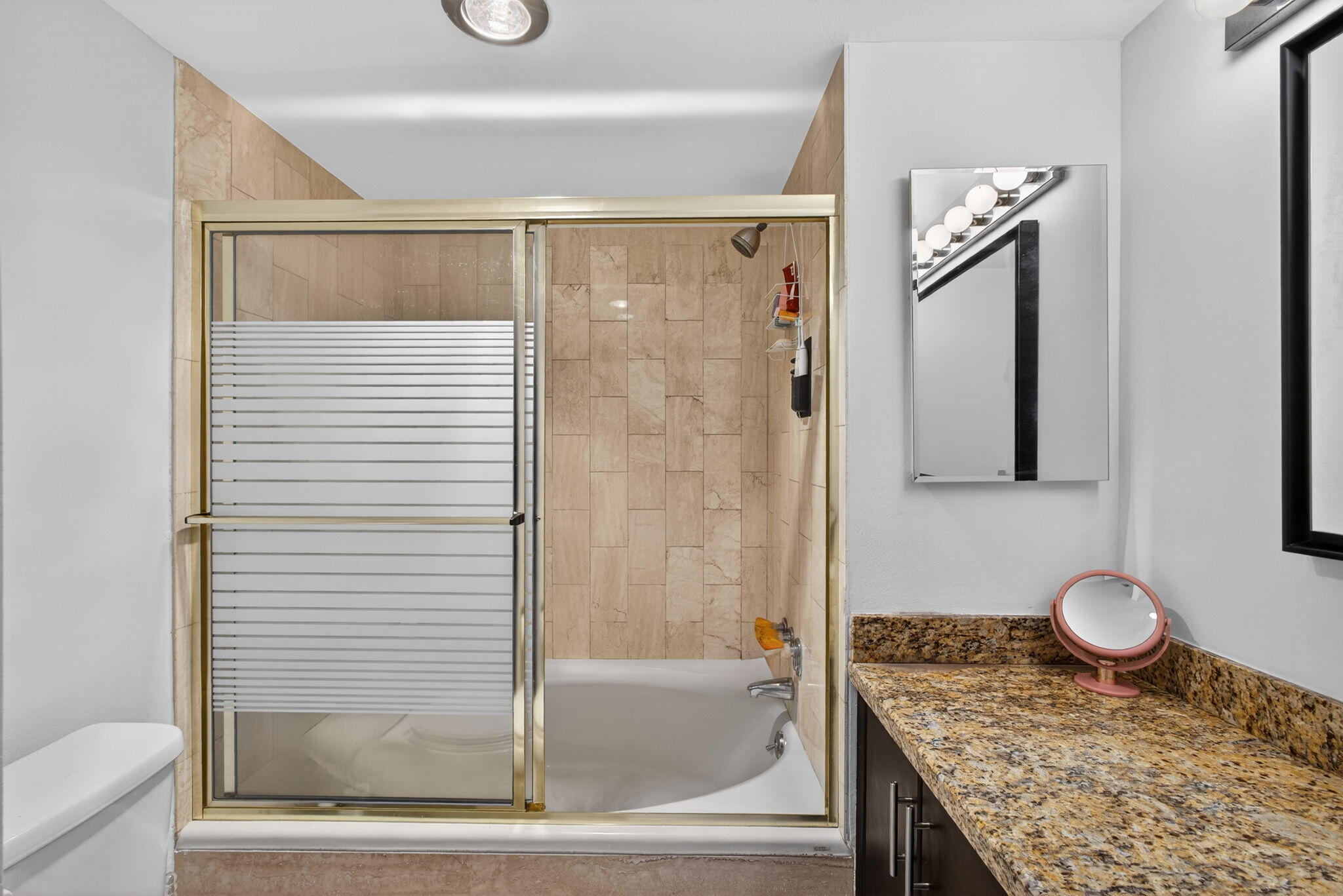 5200 North Ocean Drive, Unit 1004 Singer Island, FL 33404 - Photo 18 of 26 a bathroom with a granite countertop sink and a mirror