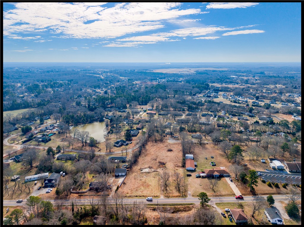 2205 Whitehall Road Anderson, SC 29625 - Photo 4 of 13 An aerial panorama reveals a serene neighborhood nestled around a tranquil pond.