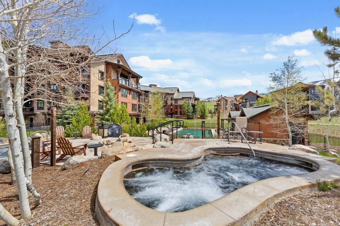 1175 Bangtail Way, Unit 5118 Steamboat Springs, CO 80487 - Photo 1 of 46 a view of a swimming pool with a lounge chairs