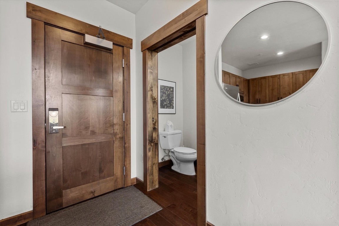 1175 Bangtail Way, Unit 5118 Steamboat Springs, CO 80487 - Photo 15 of 46 a bathroom with a toilet and a glass door shower