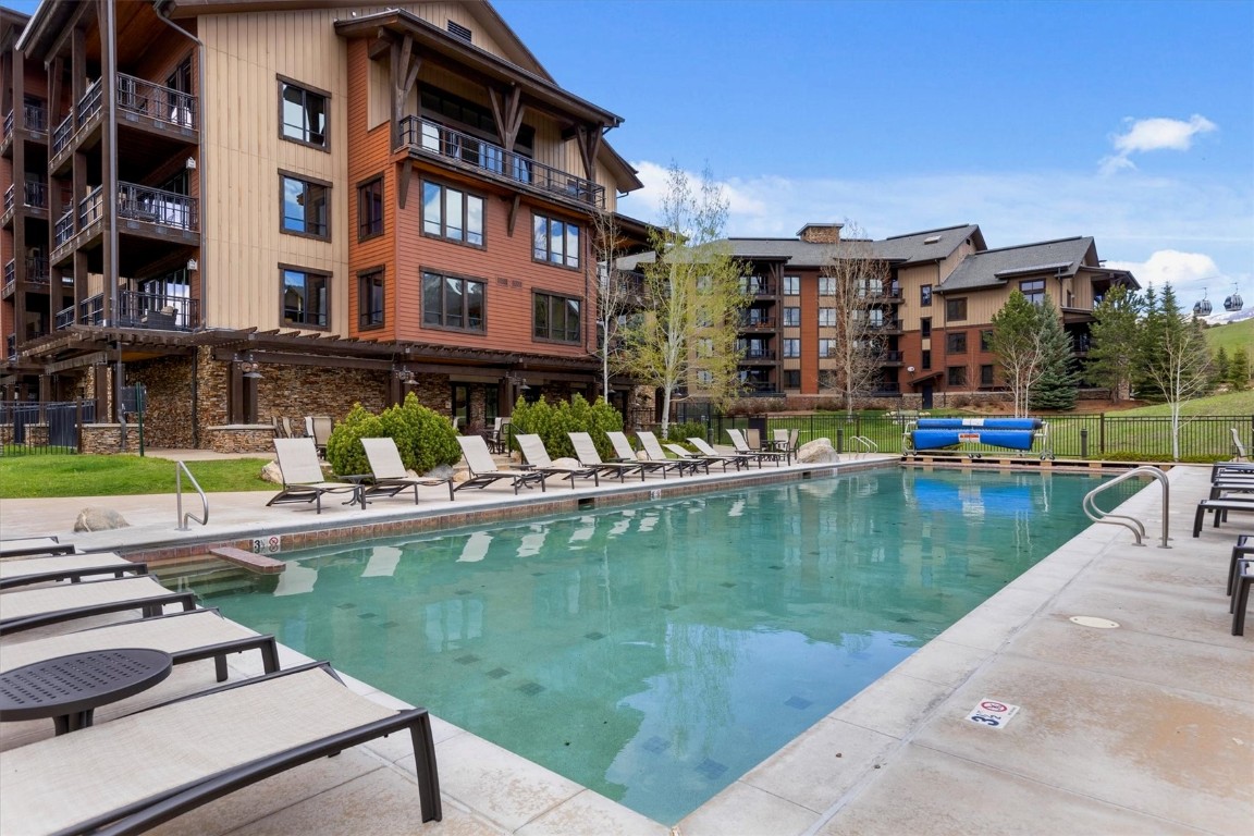 1175 Bangtail Way, Unit 5118 Steamboat Springs, CO 80487 - Photo 20 of 46 a view of swimming pool with outdoor seating