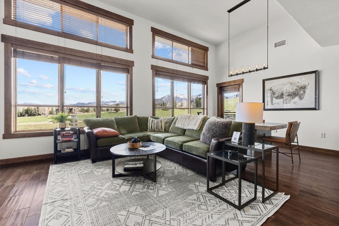1175 Bangtail Way, Unit 5118 Steamboat Springs, CO 80487 - Photo 2 of 46 a living room with furniture and a large window