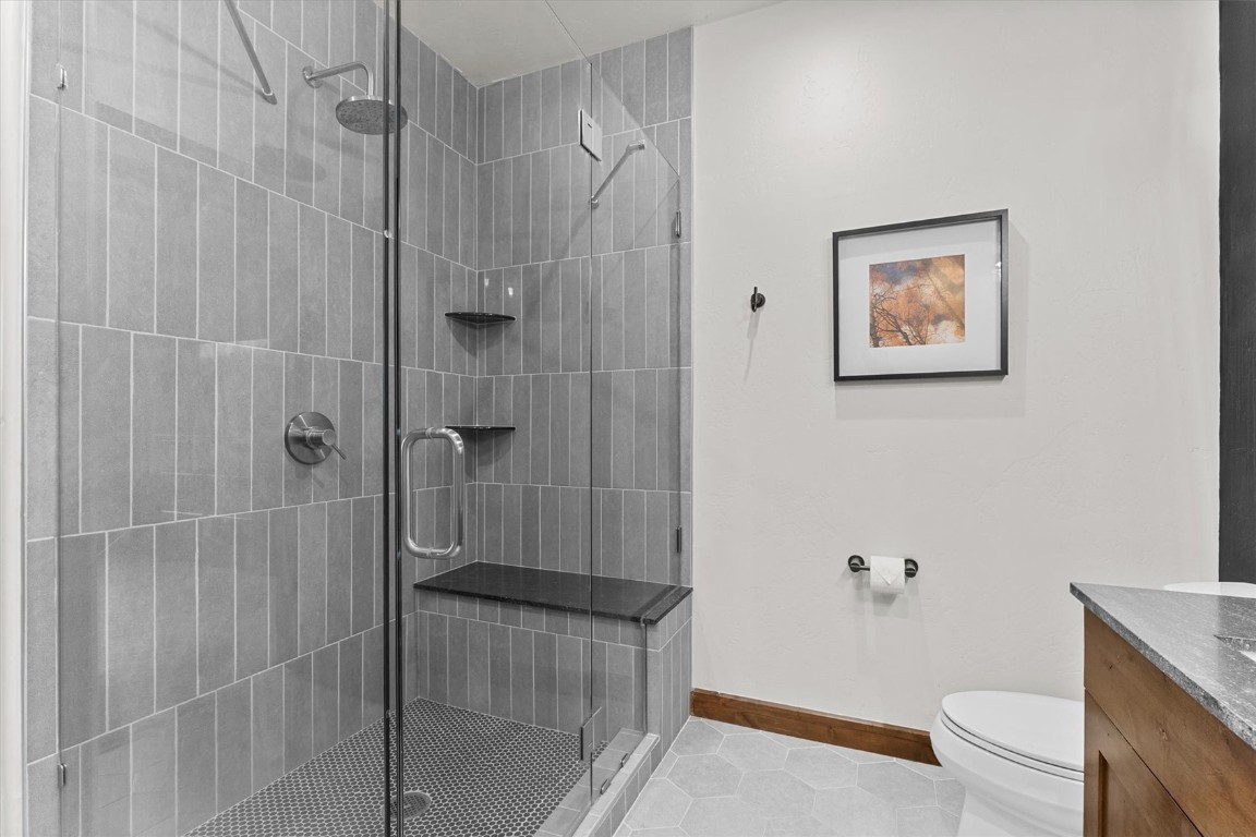 1175 Bangtail Way, Unit 5118 Steamboat Springs, CO 80487 - Photo 26 of 46 a bathroom with a shower and a toilet