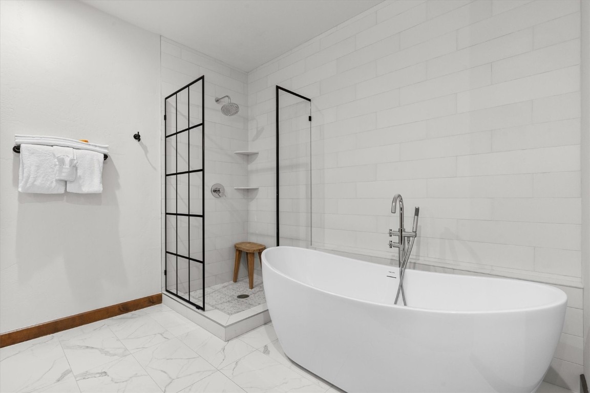 1175 Bangtail Way, Unit 5118 Steamboat Springs, CO 80487 - Photo 33 of 46 a white bath tub sitting next to a white wall