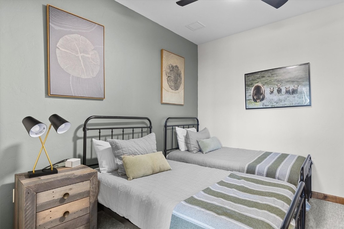 1175 Bangtail Way, Unit 5118 Steamboat Springs, CO 80487 - Photo 34 of 46 a bedroom with a bed and cupboard