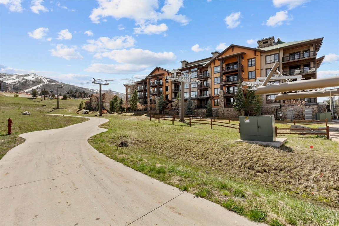 1175 Bangtail Way, Unit 5118 Steamboat Springs, CO 80487 - Photo 37 of 46 a view of a house with a yard