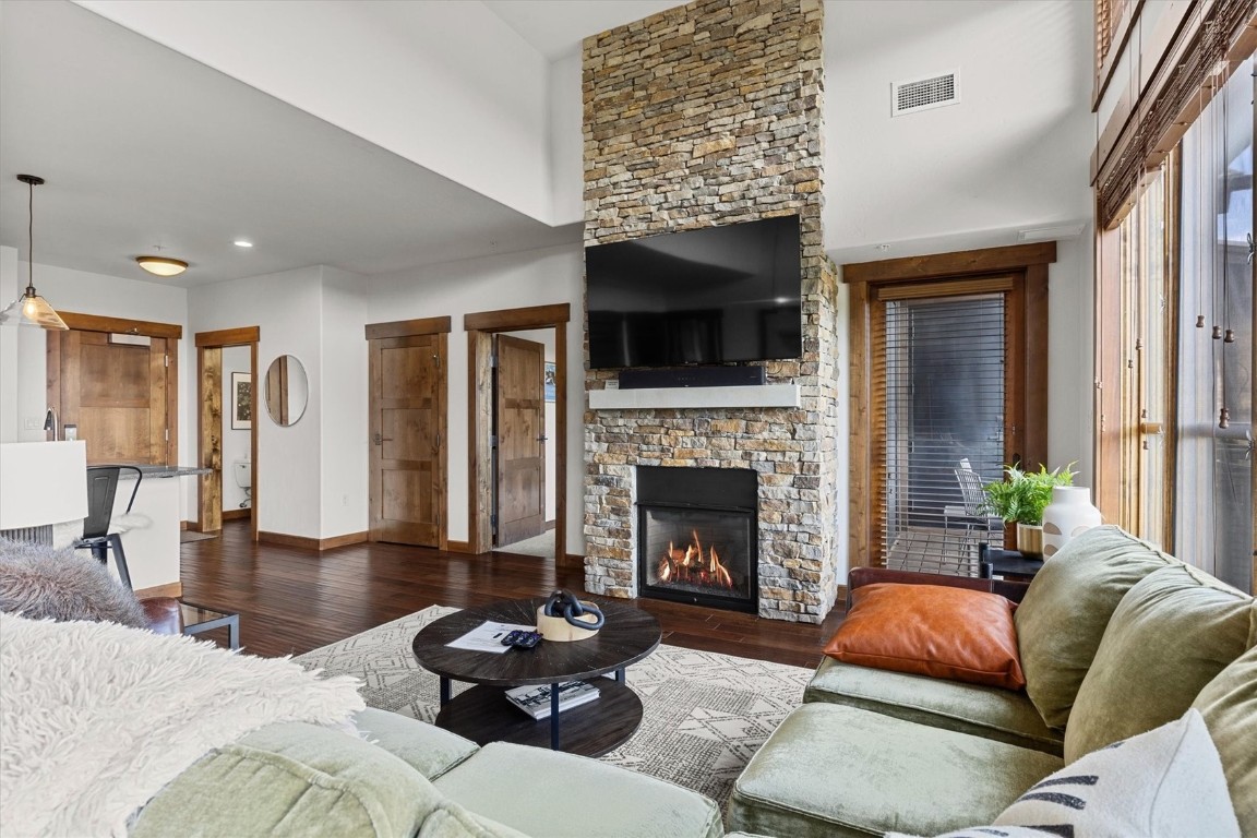 1175 Bangtail Way, Unit 5118 Steamboat Springs, CO 80487 - Photo 4 of 46 a living room with furniture and a fireplace