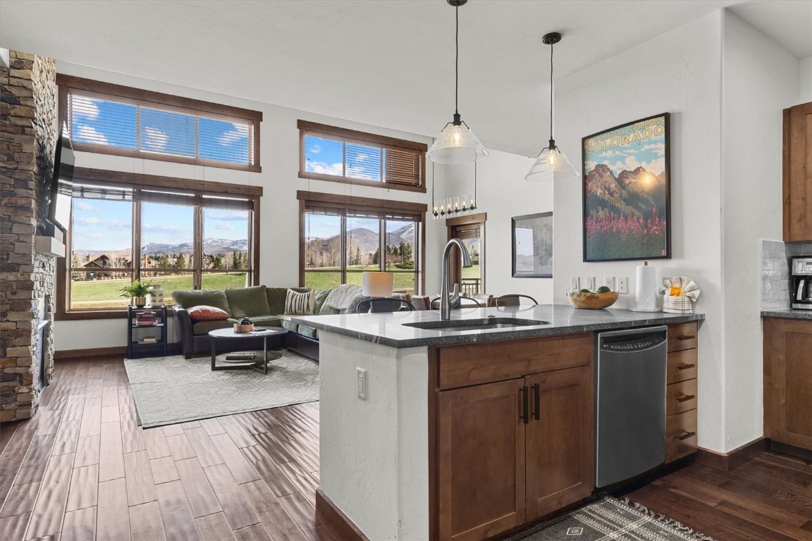 1175 Bangtail Way, Unit 5118 Steamboat Springs, CO 80487 - Photo 5 of 46 a view of living room with granite countertop furniture and a flat screen tv