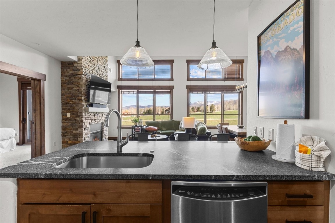 1175 Bangtail Way, Unit 5118 Steamboat Springs, CO 80487 - Photo 6 of 46 a kitchen with a sink stove and window