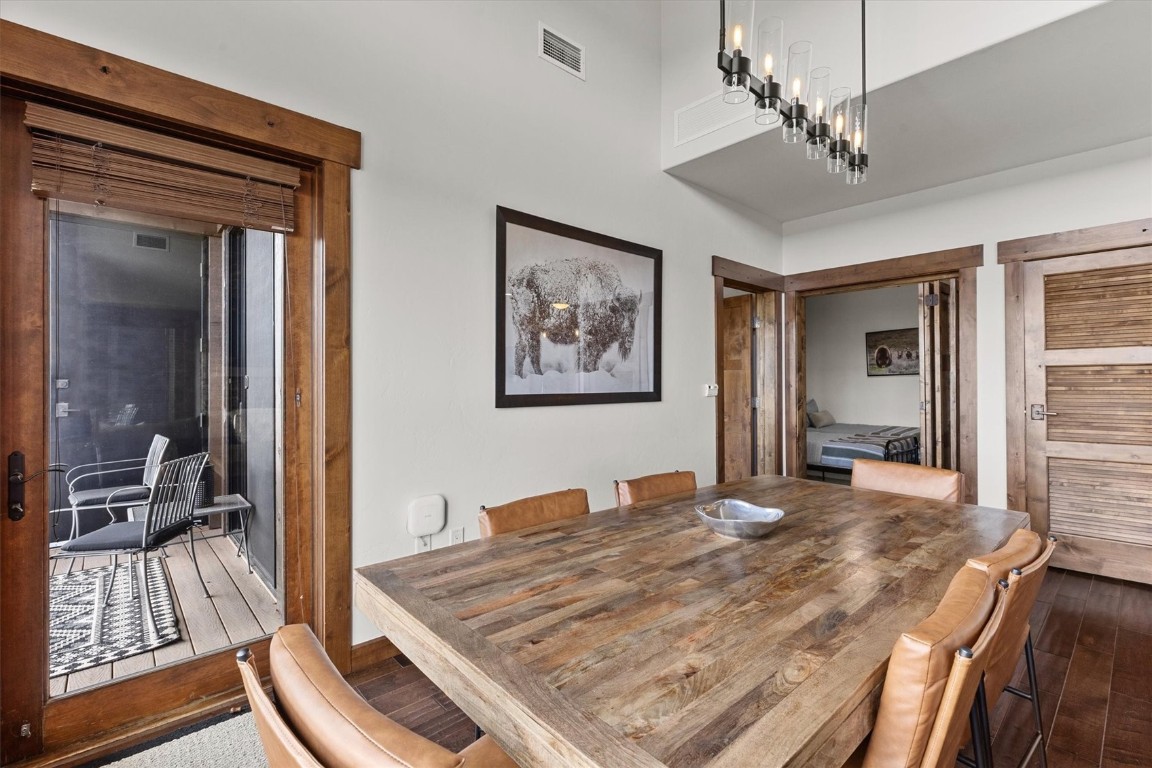 1175 Bangtail Way, Unit 5118 Steamboat Springs, CO 80487 - Photo 8 of 46 a bedroom with a bed and a large mirror on the dresser