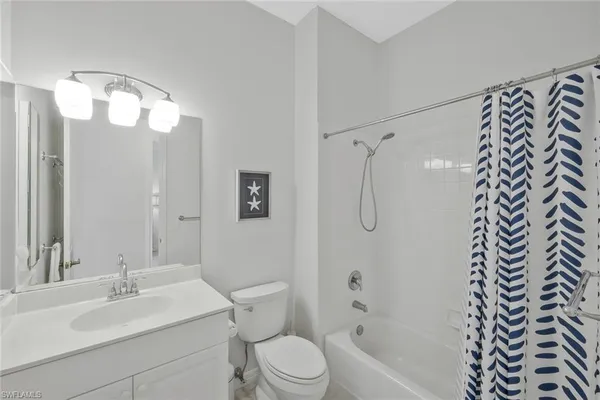 a bedroom with a bed and a chair