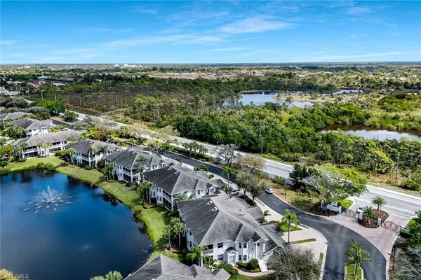 an aerial view of a city with a lake view