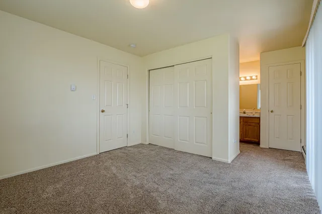 an empty room with closet area