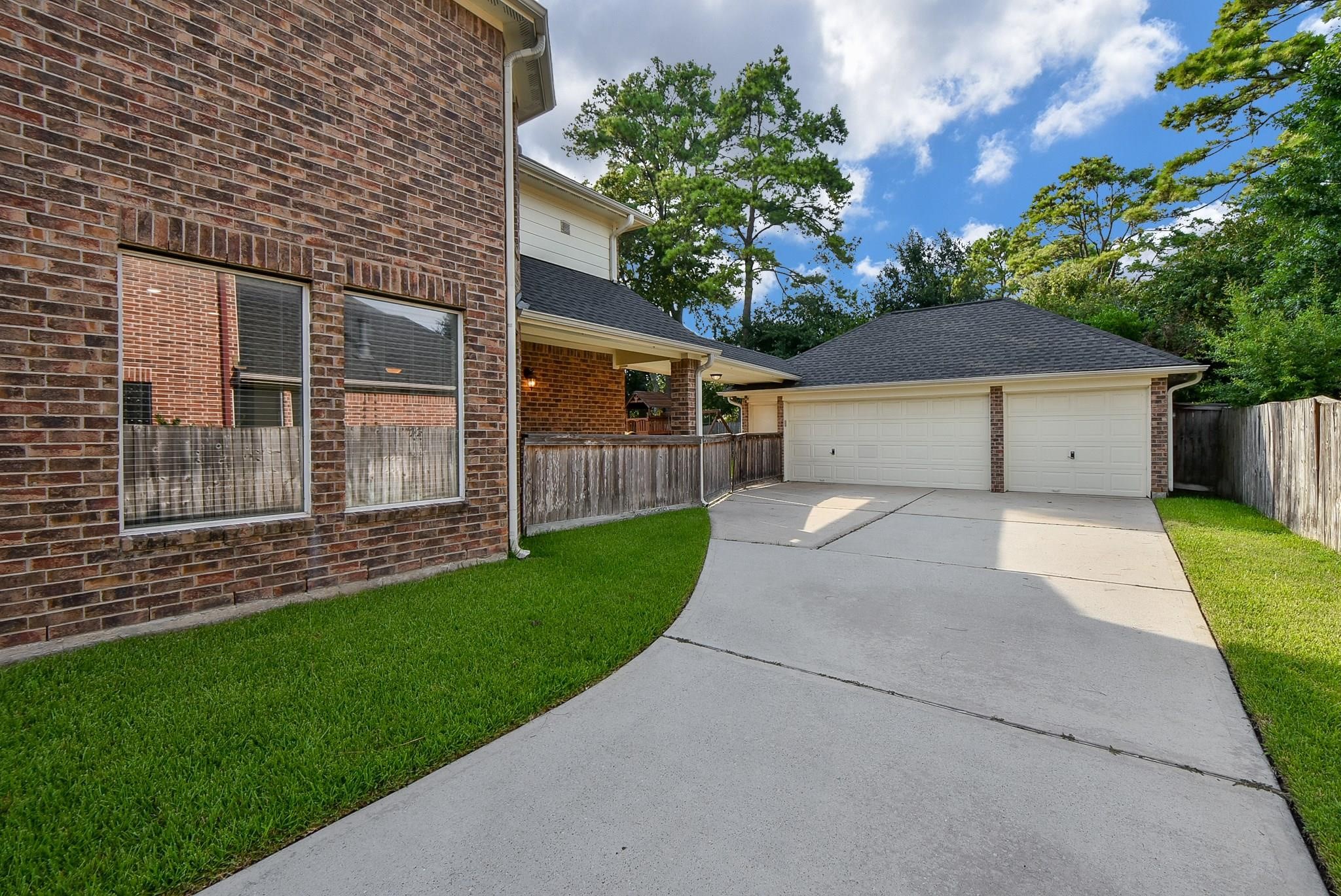 9722 Blue Cruls Way Spring, TX 77379 - Photo 6 of 49 No need to park on the street. Gate from driveway into patio area.