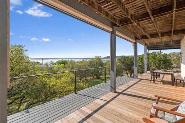 a view of a balcony with wooden floor