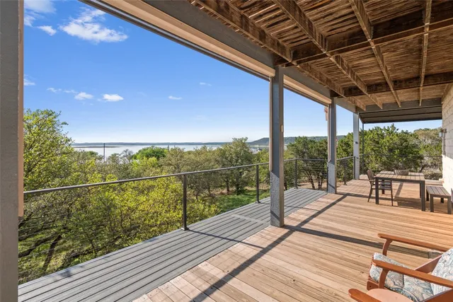 a view of a balcony with wooden floor