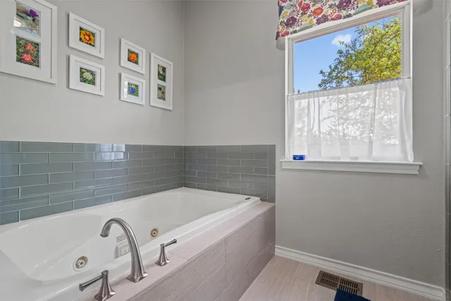 a bath tub sitting next to a window