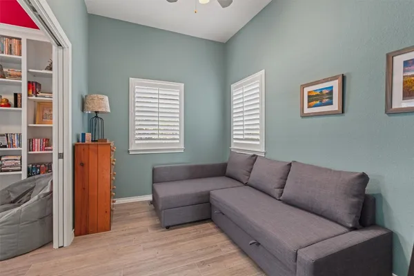 a living room with furniture and a window