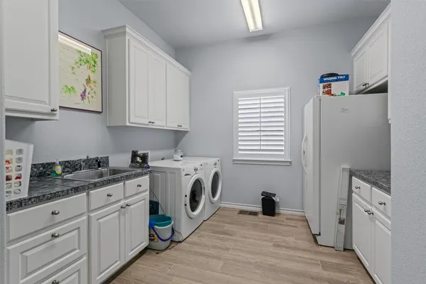 a view of a kitchen with electric appliances
