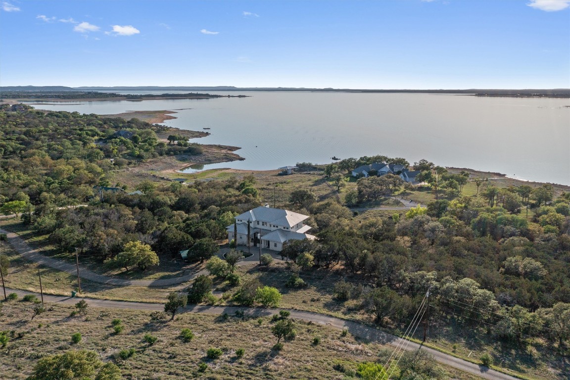 4401 Sunset Cliff Road Burnet, TX 78611 - Photo 2 of 40 a view of a lake and mountain in back