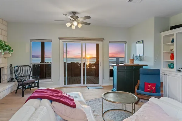 a living room with furniture fireplace and flat screen tv