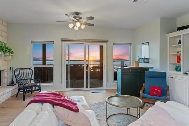 a living room with furniture fireplace and flat screen tv