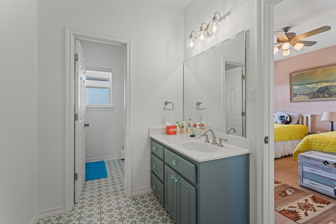 4401 Sunset Cliff Road Burnet, TX 78611 - Photo 24 of 40 a bathroom with a sink and a mirror