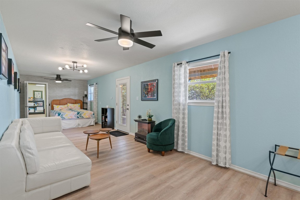 4401 Sunset Cliff Road Burnet, TX 78611 - Photo 28 of 40 a living room with furniture and a chandelier