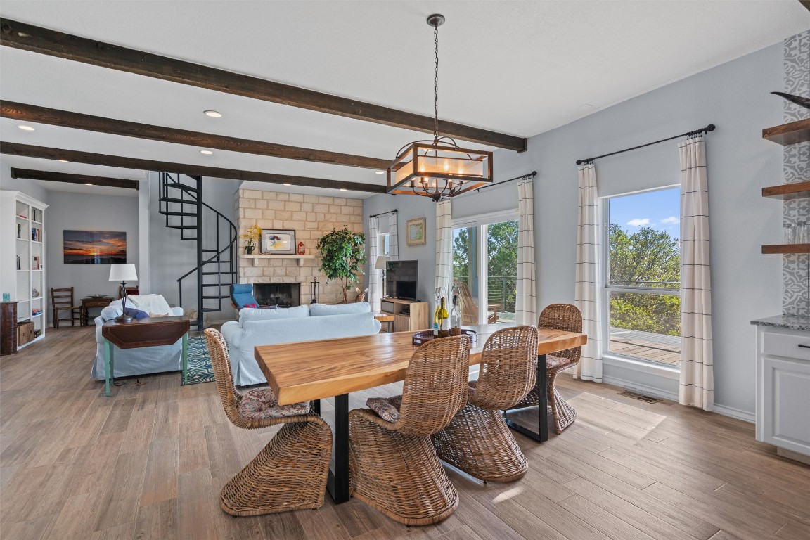 4401 Sunset Cliff Road Burnet, TX 78611 - Photo 8 of 40 a dining room with wooden floor and windows