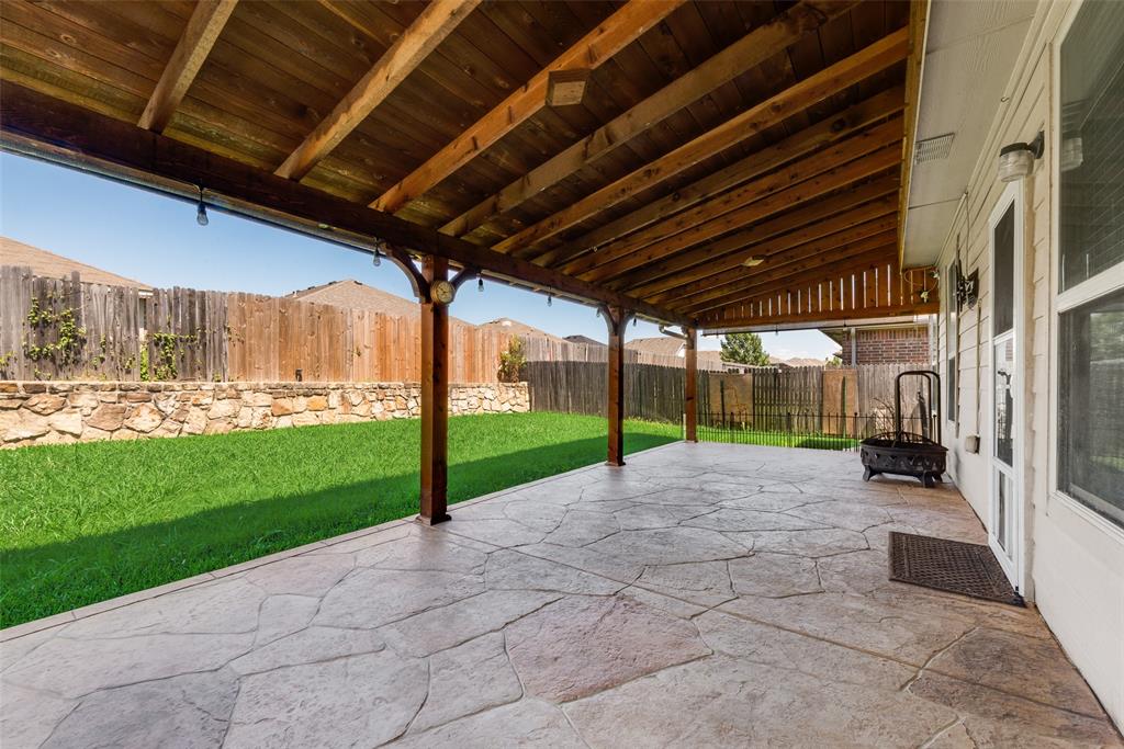 2004 Karsen Lane Heartland, TX 75126 - Photo 17 of 18 a view of a backyard with wooden fence