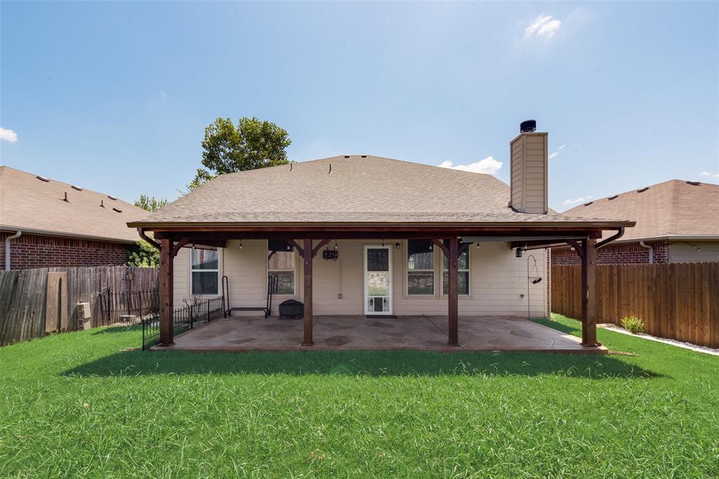 2004 Karsen Lane Heartland, TX 75126 - Photo 18 of 18 a front view of a house with garden