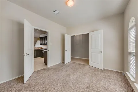 a view of a kitchen with a sink and a window