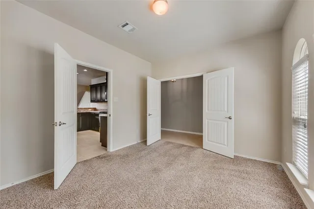 a view of a kitchen with a sink and a window