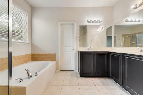 a bathroom with a bathtub and a sink