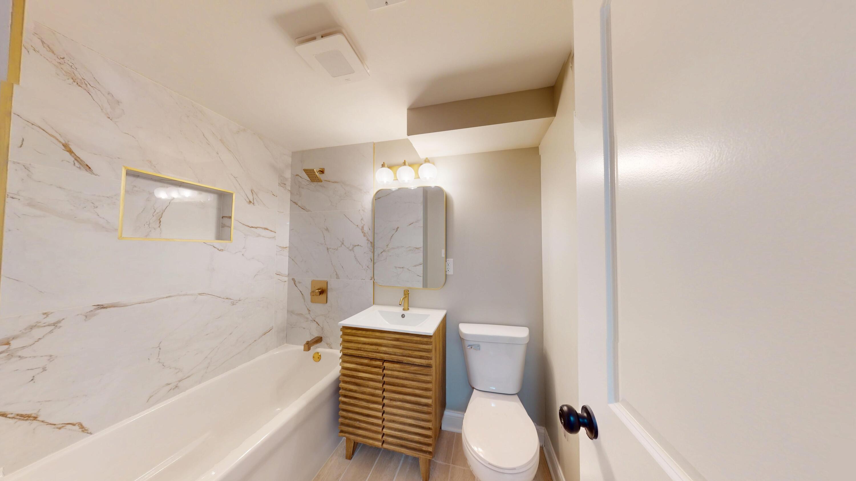 1528 Hanley Street Gary, IN 46406 - Photo 11 of 44 a bathroom with a sink toilet and shower