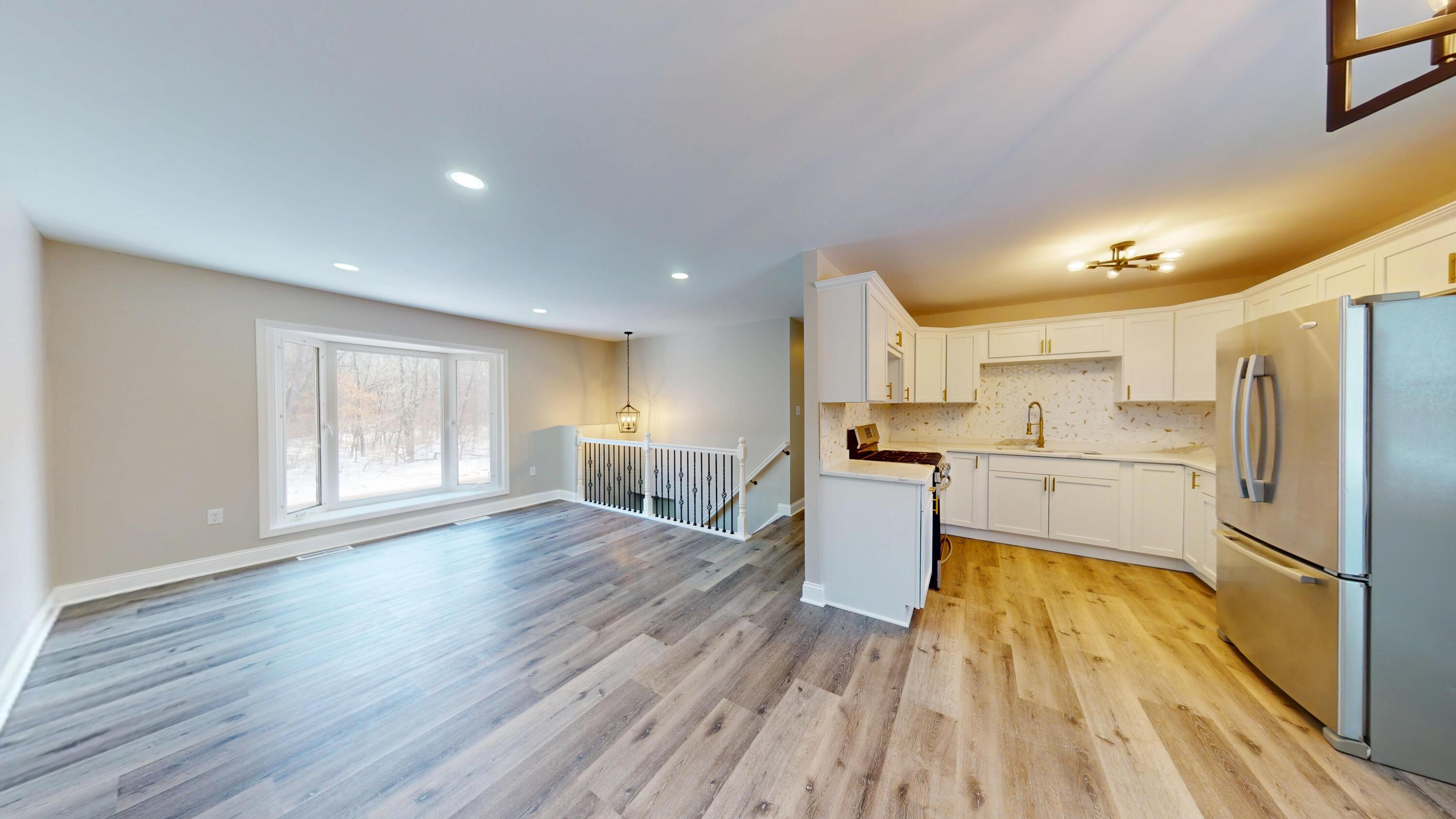 1528 Hanley Street Gary, IN 46406 - Photo 23 of 44 a kitchen with white cabinets and stainless steel appliances