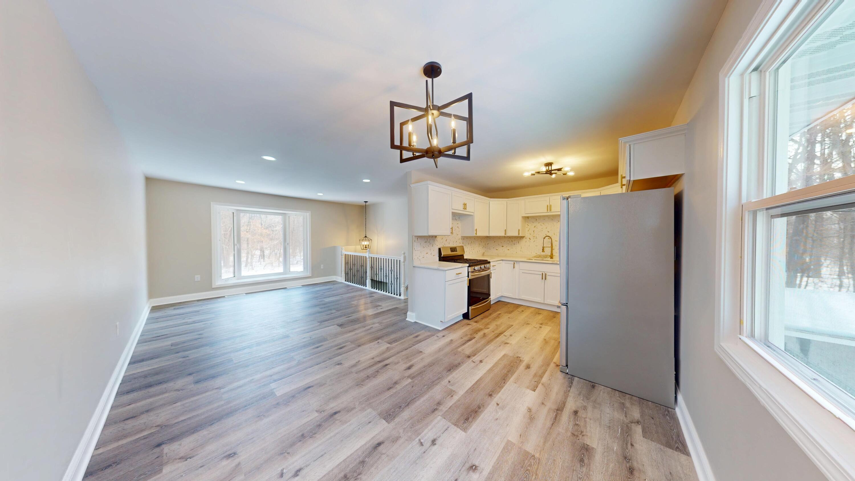 1528 Hanley Street Gary, IN 46406 - Photo 24 of 44 a view of a kitchen with wooden floor and a window