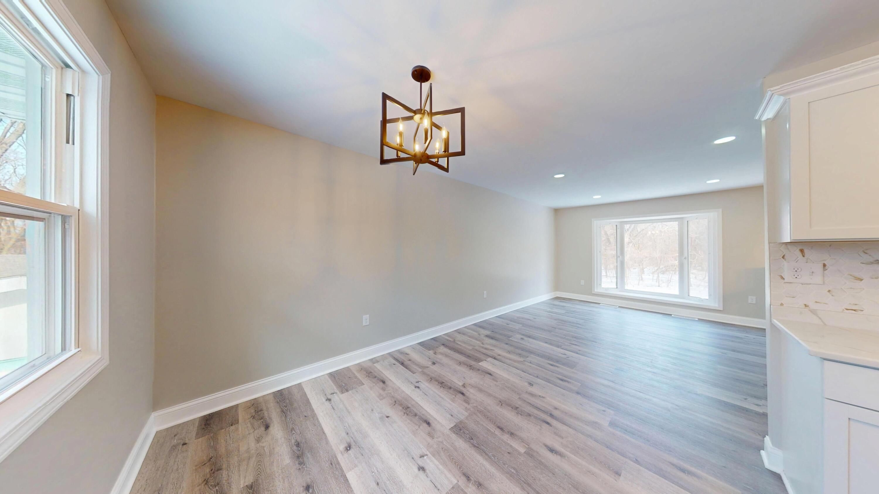 1528 Hanley Street Gary, IN 46406 - Photo 25 of 44 a view of empty room with wooden floor and fan