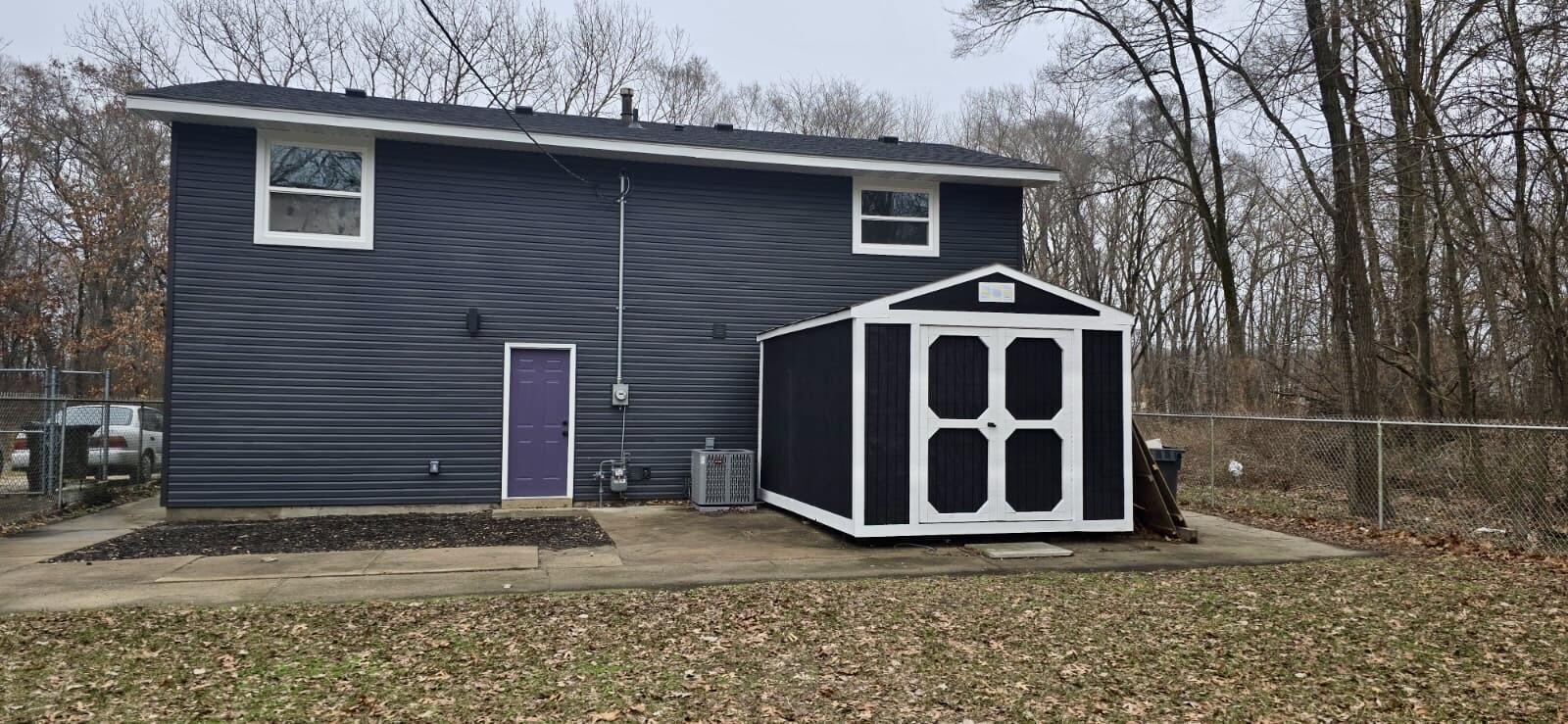 1528 Hanley Street Gary, IN 46406 - Photo 27 of 27 a front view of a house with garden