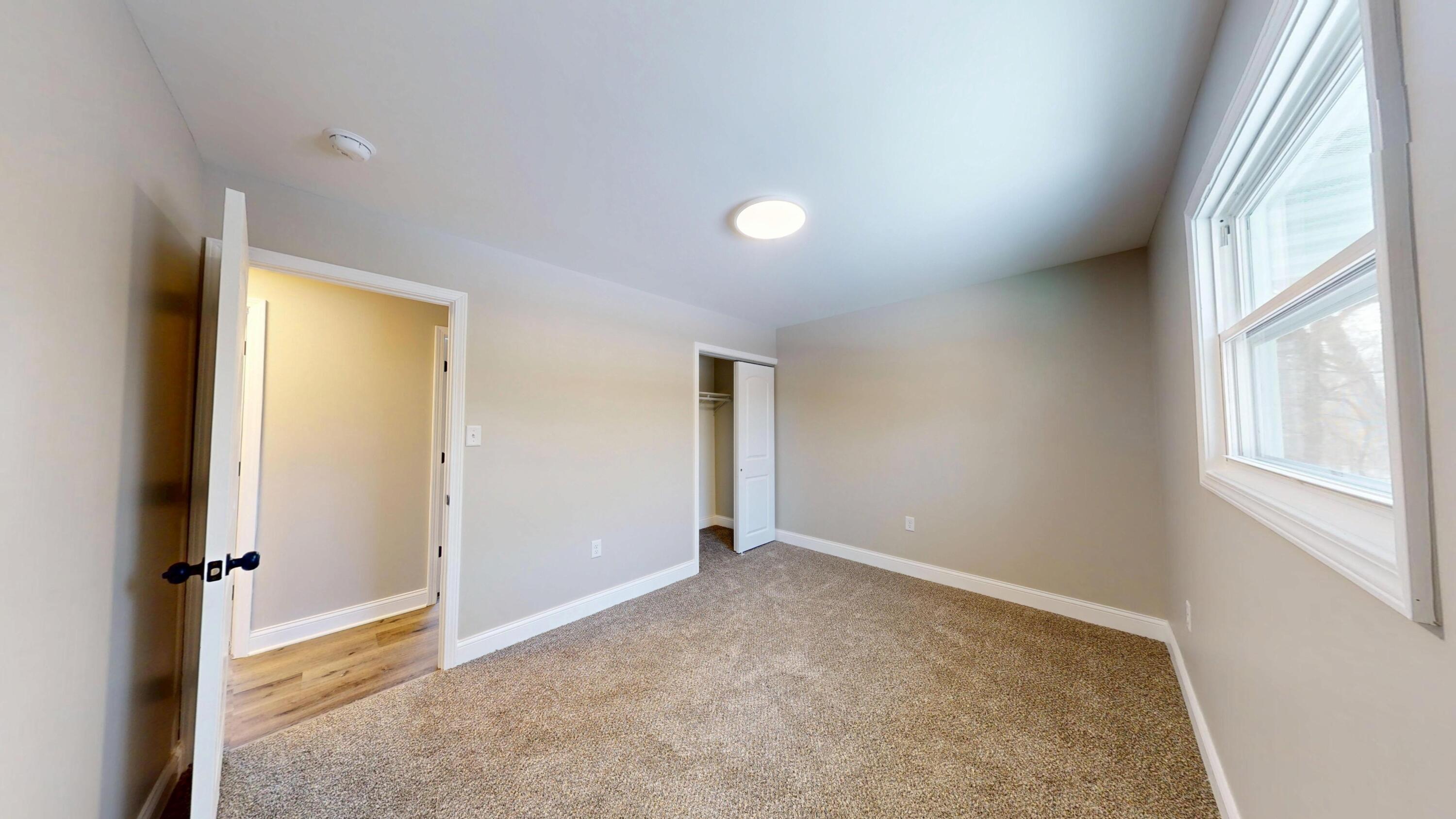 1528 Hanley Street Gary, IN 46406 - Photo 35 of 44 an empty room with windows and closet