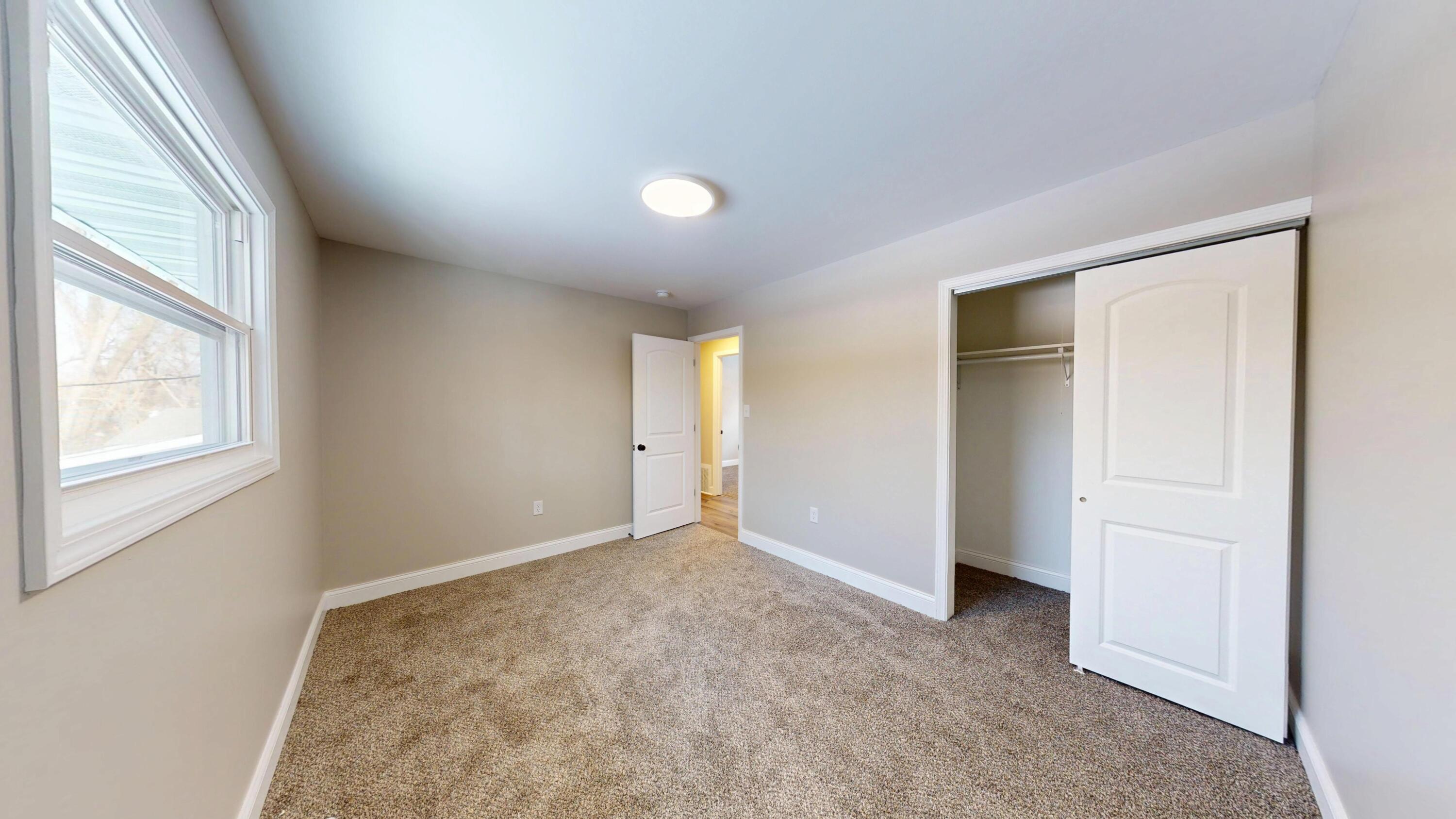 1528 Hanley Street Gary, IN 46406 - Photo 36 of 44 an empty room with windows and closet