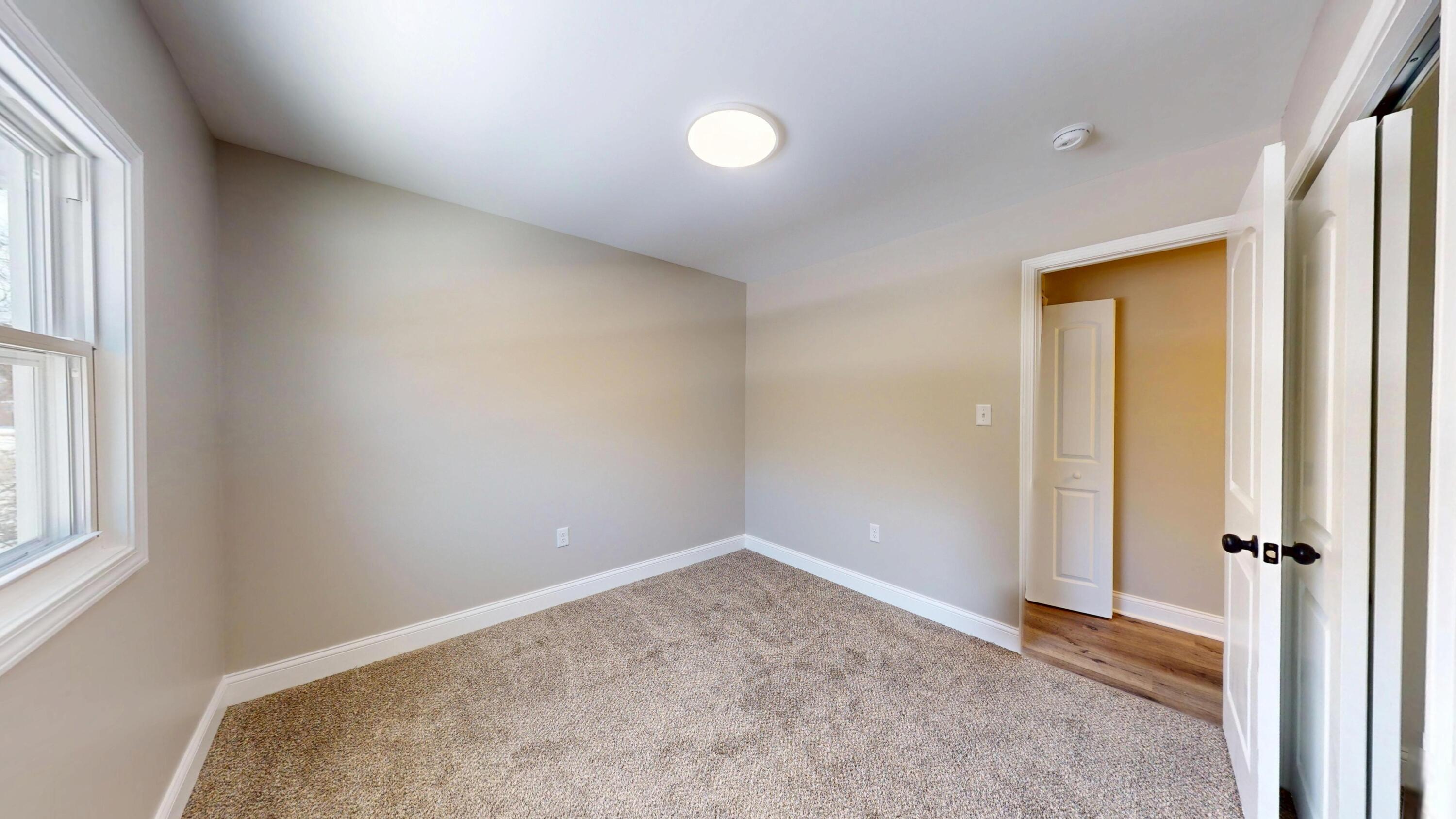 1528 Hanley Street Gary, IN 46406 - Photo 38 of 44 an empty room with windows and closet