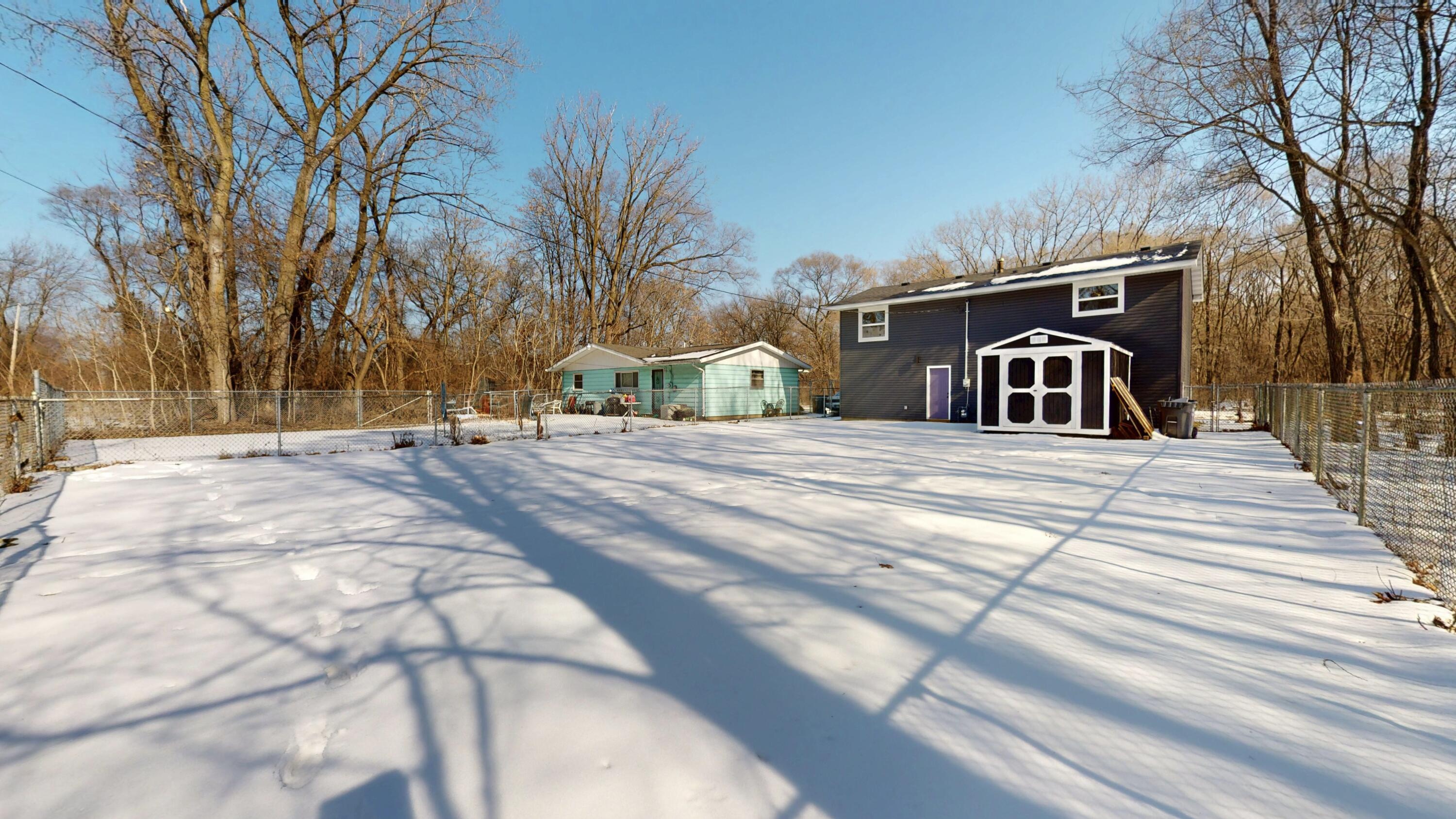 1528 Hanley Street Gary, IN 46406 - Photo 43 of 44 a view of a house with snow on the road